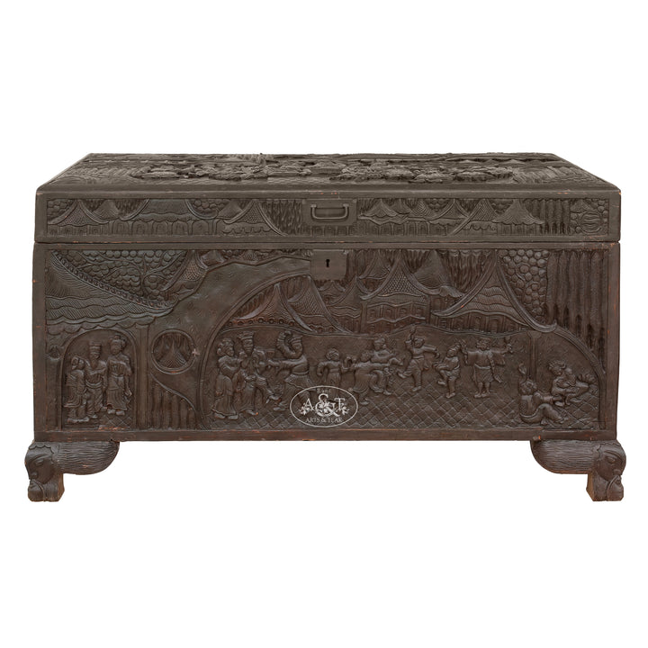 Decorative wooden chest with intricate carvings on a white background