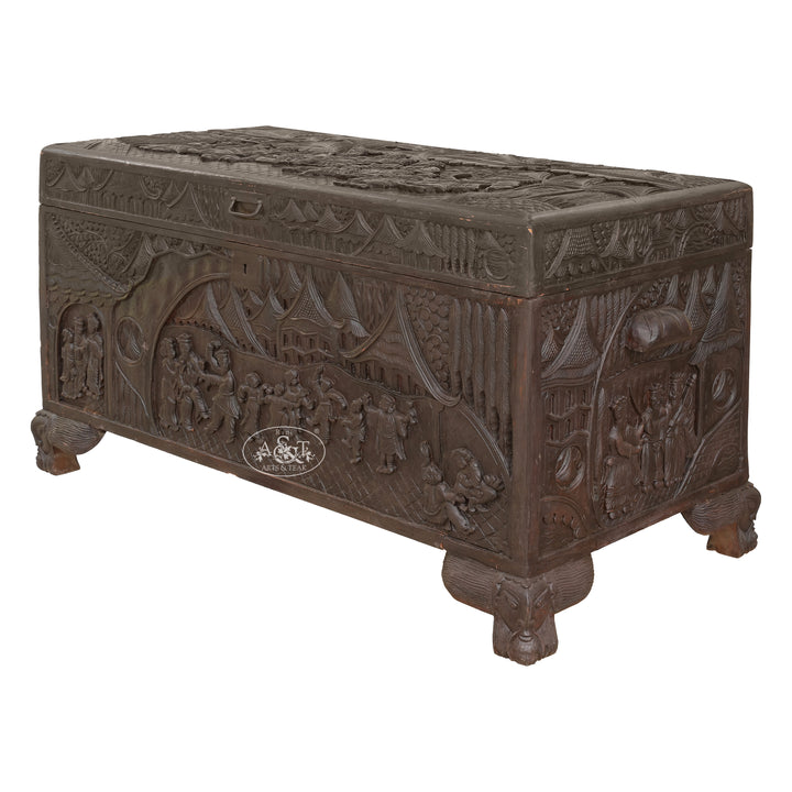 Decorative wooden chest with intricate carvings on a white background