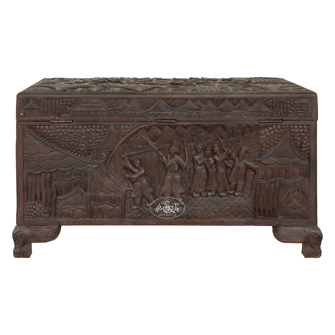 Carved wooden chest with intricate designs on a white background