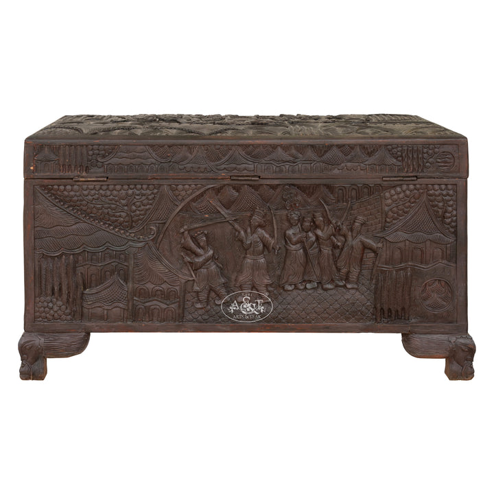Carved wooden chest with intricate designs on a white background