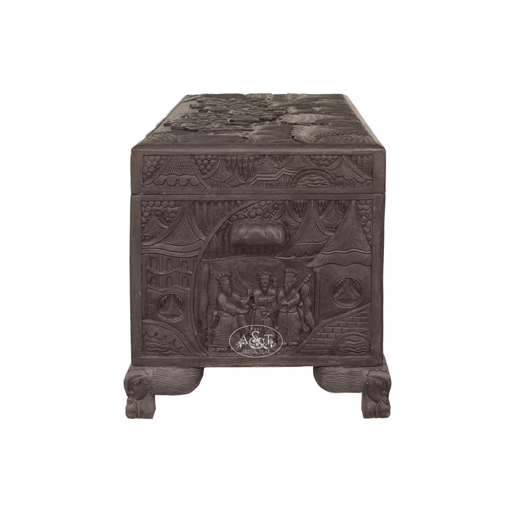 Decorative wooden box with intricate carvings on a white background