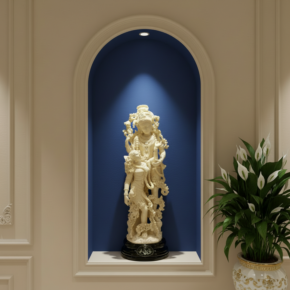 Decorative statue in a niche with a plant on a beige wall