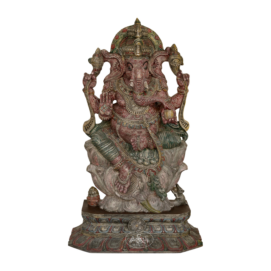 Decorative statue of a deity with intricate details on a white background