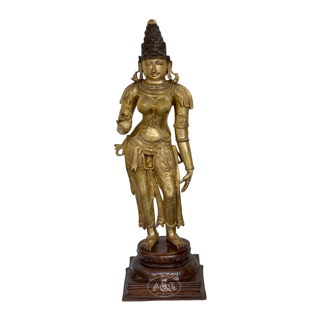 Brass statue of a deity on a white background