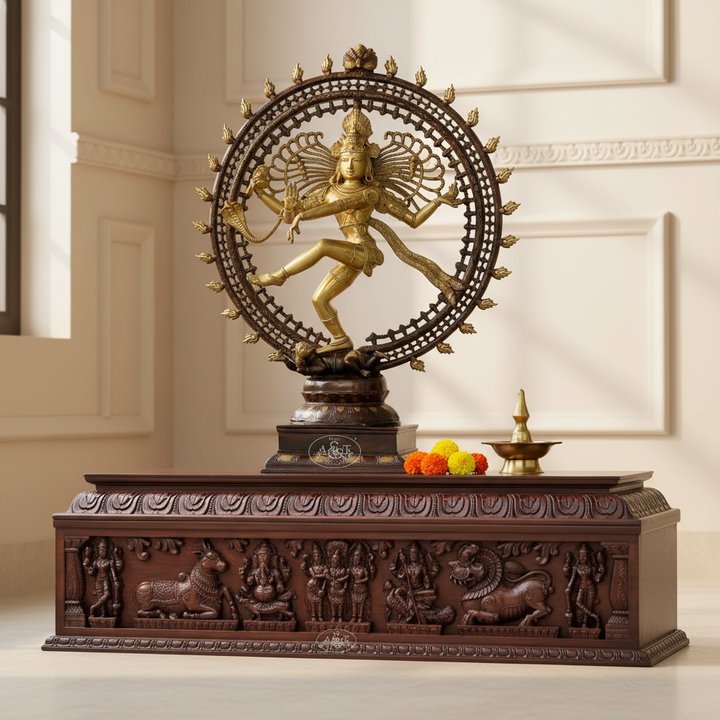 Decorative statue of a dancing figure on a pedestal with intricate carvings in a room setting.