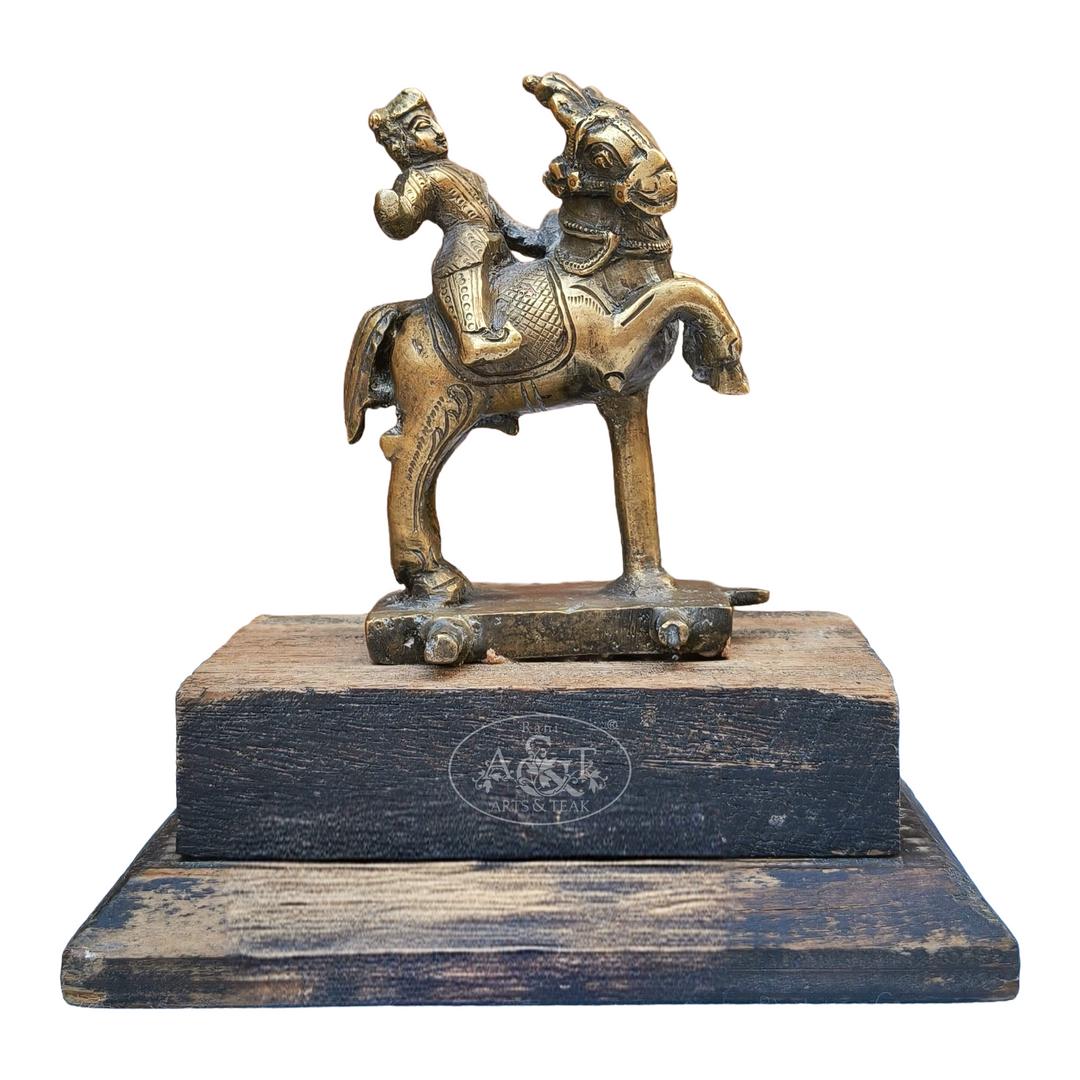 Bronze statue of a figure on a horse with a wooden base, featuring a brand logo.