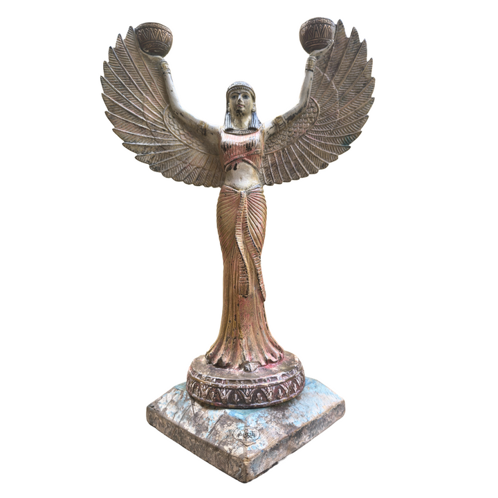 Statue of a winged figure on a white background